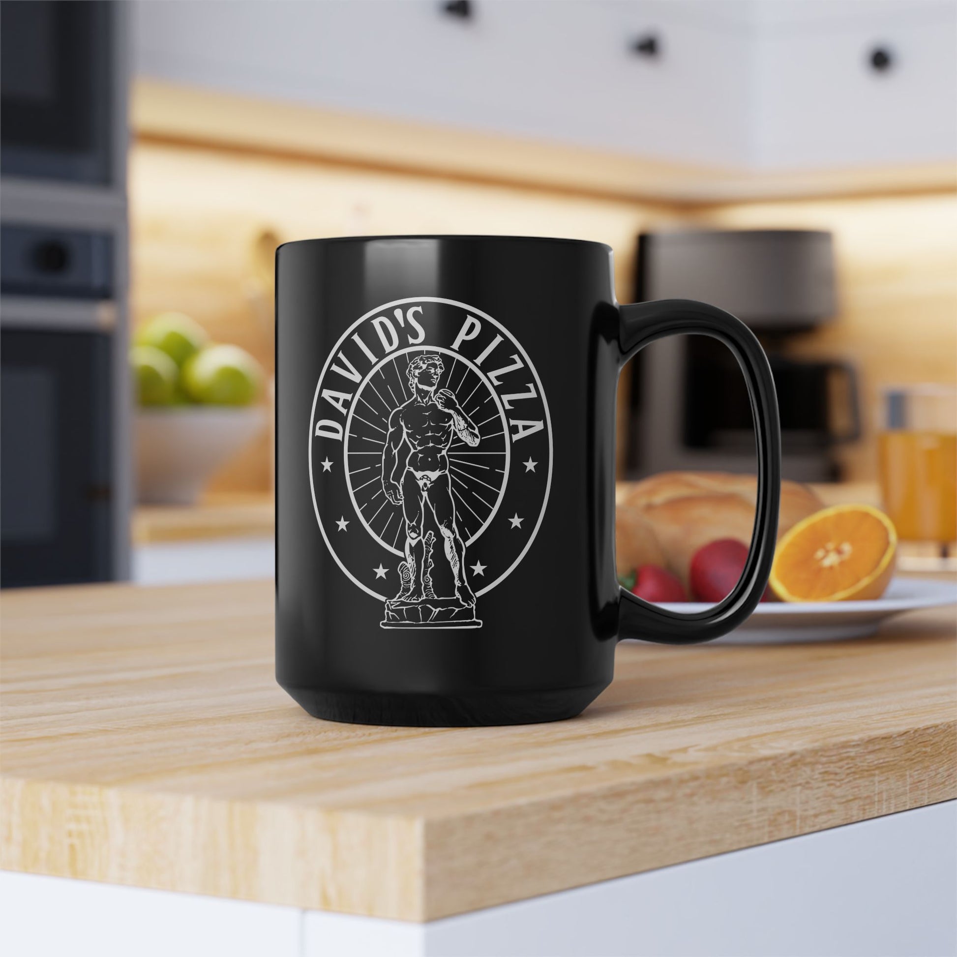 Black mug with 'David's Pizza' logo on a kitchen counter
